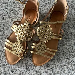 Metallic Gold Sandals with Woven Straps and Flat Sole